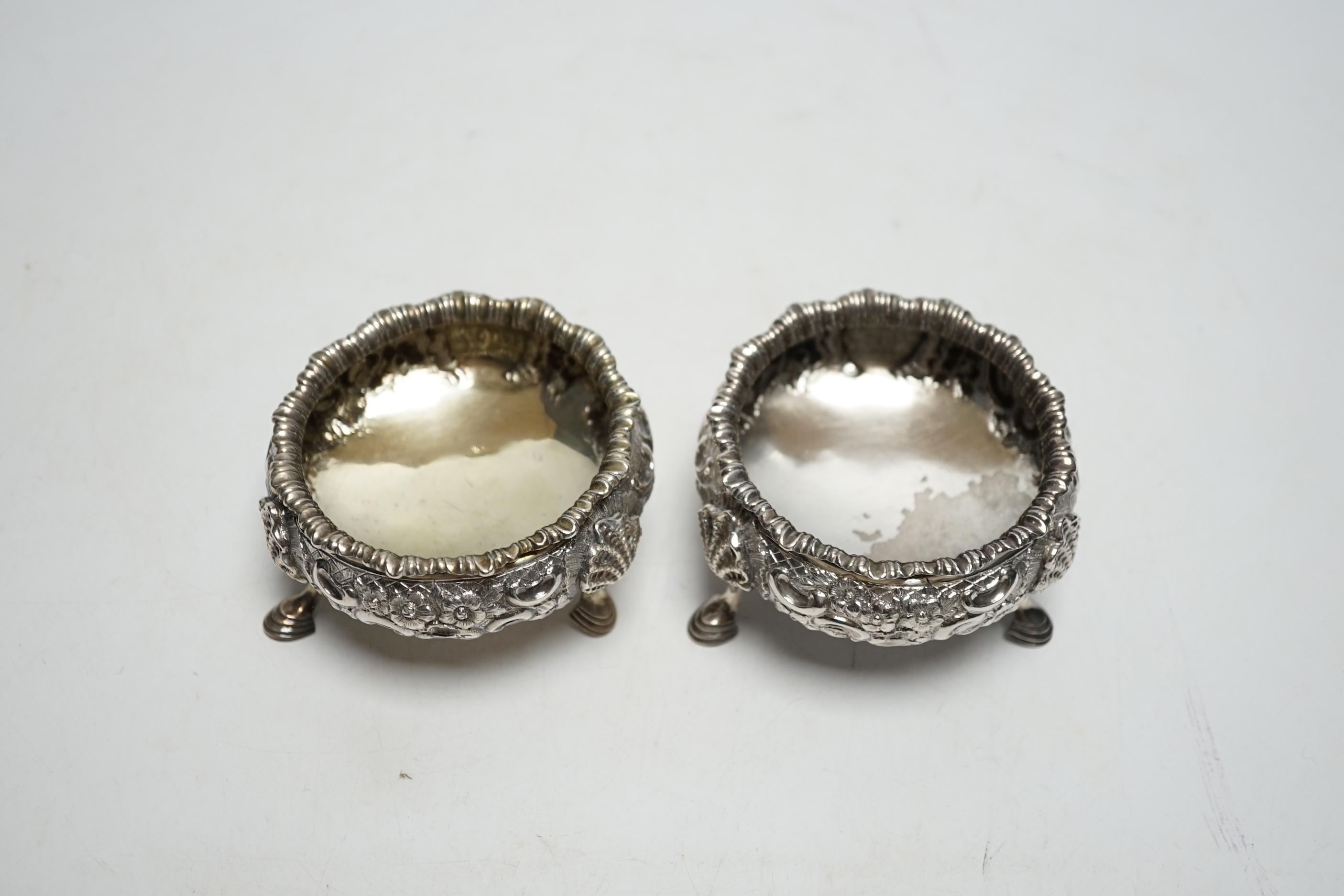 A pair of Victorian embossed silver bun salts, London, 1848, diameter 75mm.